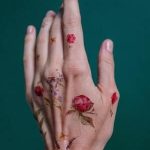 Small red ink tattoos
